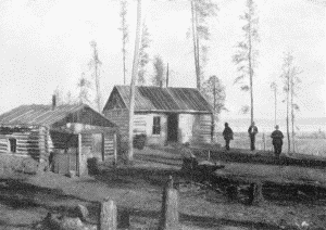 a. Trader's store at the village of the Pillagers, Cass Lake in the distance on the right.  November 26, 1899