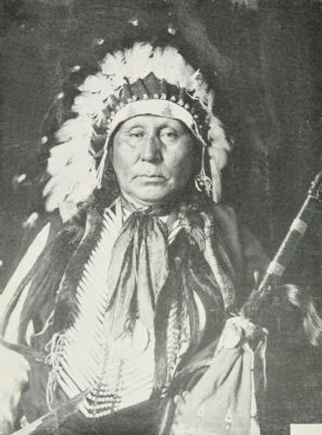 An older man in traditional dress.